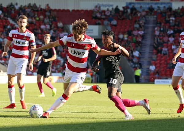 Siriki Dembele of Peterborough United in action against Doncaster Rovers. Photo: Joe Dent/theposh.com