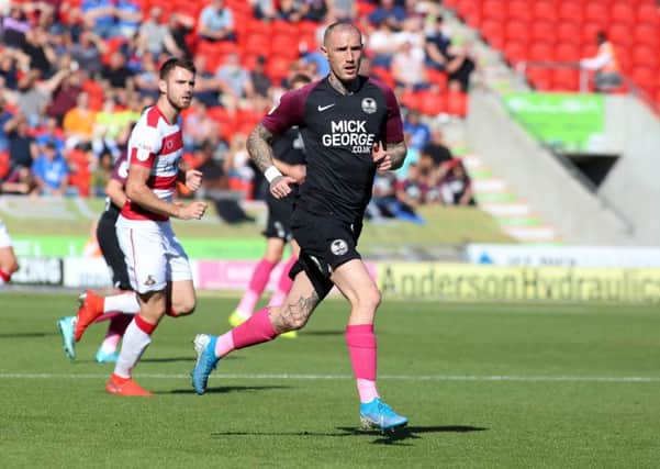 Marcus Maddison in action for Posh at Doncaster. Photo: Joe Dent/theposh.com.
