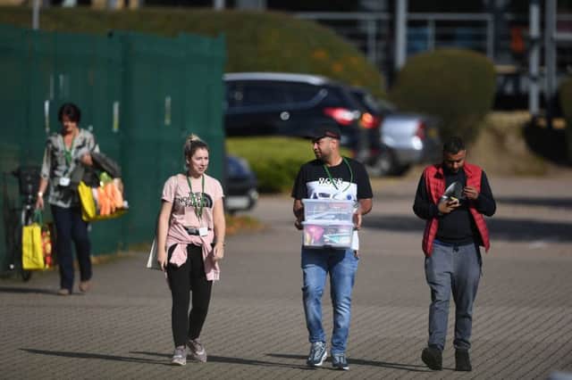 Staff leaving Thomas Cook's headquarters in Lynch Wood. Photo: Joe Giddens/PA Wire