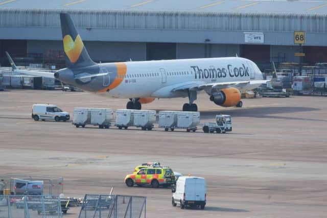 A Thomas Cook aircraft parked at Manchester Airport. Photo: Peter Byrne/PA Wire