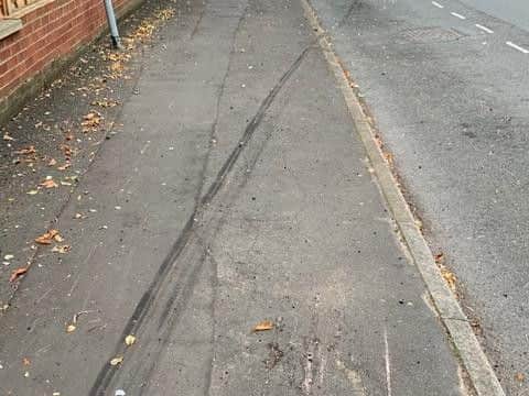 Skid marks on the road and pavement