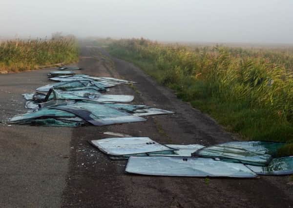 Windscreens dumped at Sheppards Drove in Crowland. Photo: @tincanstorm