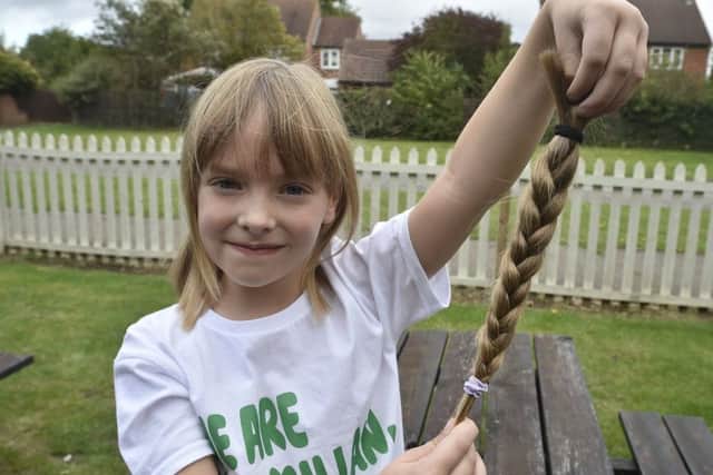 Lillie-Evelyn Smith (6) have a haircut in aid of Little Princess Trust at the Dragon pub, Werrington. EMN-190928-182015009