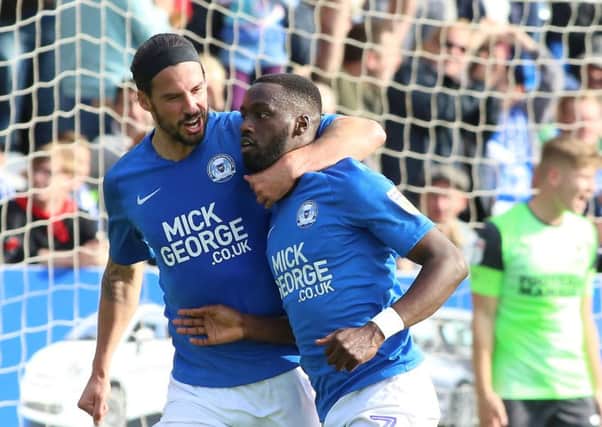 Mo Eisa (right) and George Boyd celebrate the second Posh goal against AFC Wimbledon. Photo: Joe Dent/theposh.com.