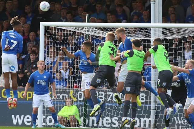 Goalmouth action between Peterborough United and AFC Wimbledon. Photo: Joe Dent/theposh.com.