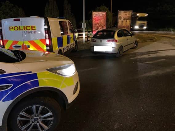 Police seizing the car. Photo: Cambridgeshire police