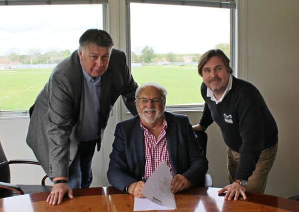 Colin Ward (centre) and Bob Limming (left) from Live Promotions, together with Jason Lunn (right), venue director of the East of England Arena, sign the deal to keep Truckfest in Peterborough