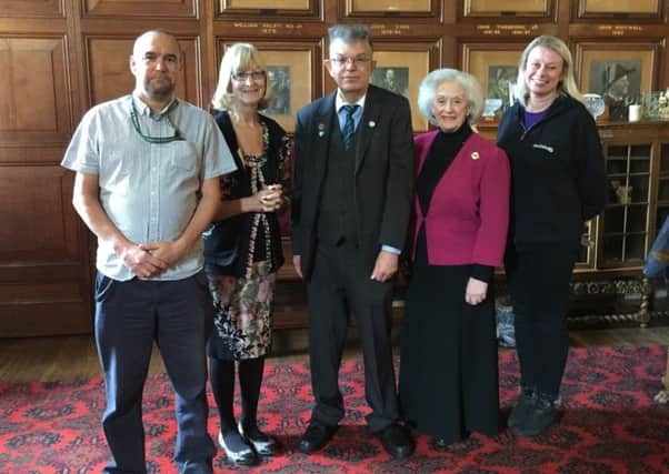 Receiving funds from Chris Ash (centre) are (left to right) Gary Sutcliffe from the Alzheimer's Society, Maureen Wood from Light Project Peterborough and Shirley Scotcher from Deafblind UK. Also pictured is former Mayoress Doreen Roberts