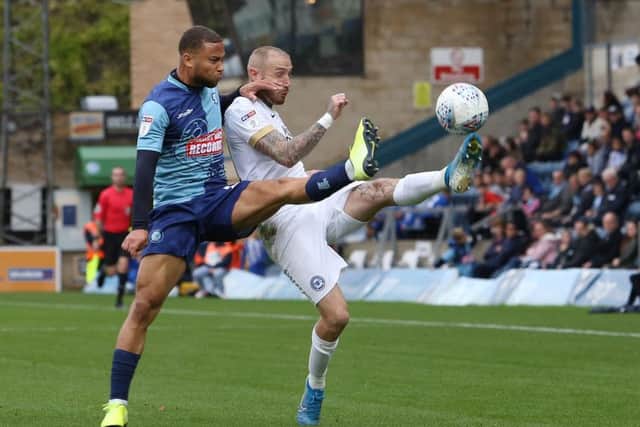 Marcus Maddison of Peterborough United in action with Curtis Thompson of Wycombe Wanderers. Photo: Joe Dent/theposh.com