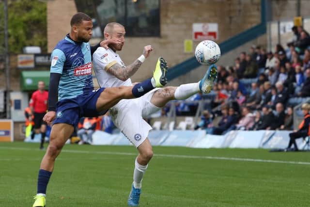 Marcus Maddison of Peterborough United in action with Curtis Thompson of Wycombe Wanderers. Photo: Joe Dent/theposh.com.