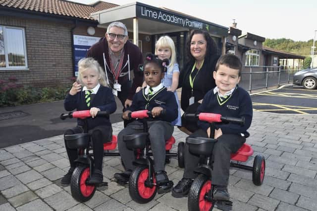 Lime Parnwell Academy Parnwell  head teacher Sarah Cullen with Dave Tye from the Kingsgate Community Church who have supplied trikes for pupils in EYFS EMN-190930-230614009