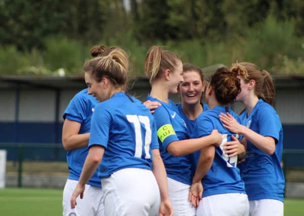 Posh celebrate a goal for Donna McGuigan (14) against Stevenage. Photo: Gary Reed.
