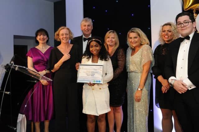 Sindie Sigola picks up her award