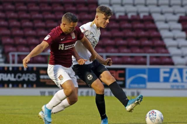 Posh midfielder Harrison Burrows (white shirt) is pushing for a first-team start.