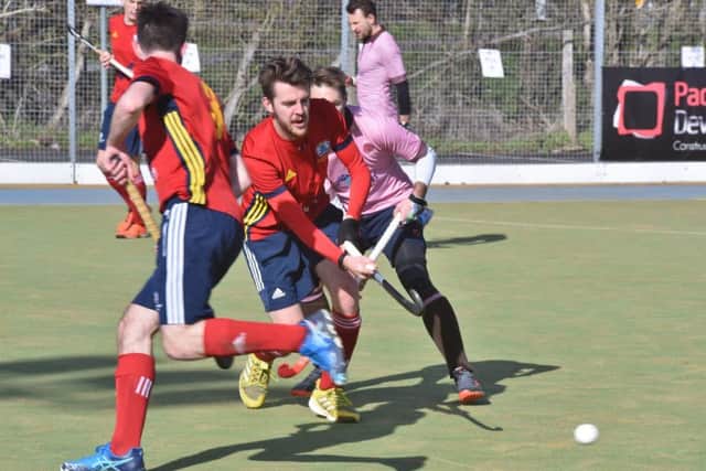 Adam Wilson (red) scored for City of Peterborough against Cardiff & Met.