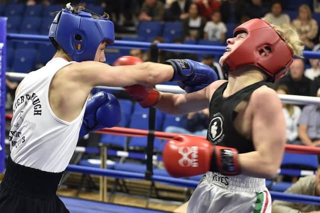 Jack Singleton (red) from Whitlesey ABC and  Kai Papworth from Peterborough Police ABC. Photo: David Lowndes.