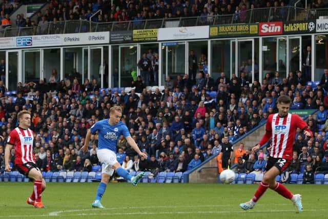 Posh midfielder Louis Reed opens the scoring against Lincoln. Photo: Joe Dent/theposh.com.