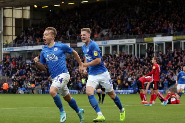 Posh midfielder Louis Reed's goal celebration during the win over Lincoln.