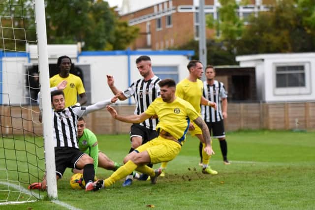 Goalmouth scramble in the game between Peterborough Sports and St Ives. Photo: James Richardson.