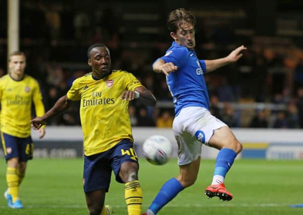 Alex Woodyard (right) could start for Posh at Gillingham.