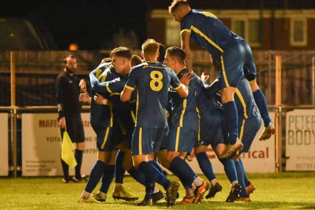 Peterborough Sports celebrate their winning goal against Nuneaton. Photo: James Richardson.
