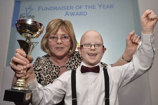 Peterborough Telegraph Pride in Peterborough Awards 2018. Fundraiser of the Year Louis King with  his TA from Southview Primary school, Crowland Susan Newton EMN-181112-003153009