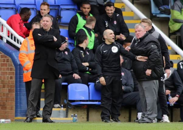 Posh manager Darren Ferguson (left) and Rotherham manager Steve Evans during a game at London Road in 2014.