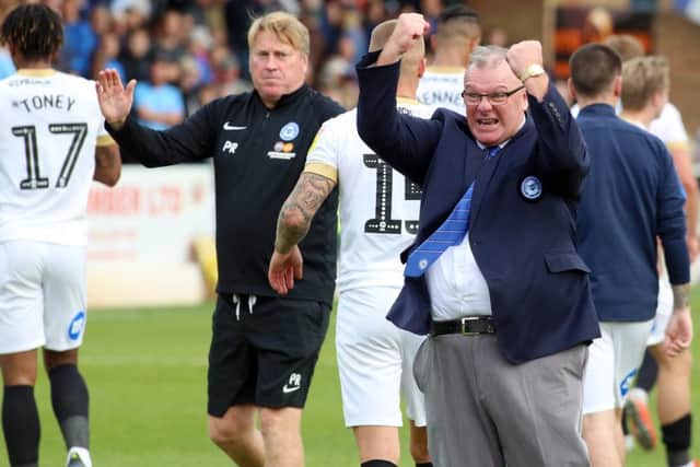 Steve Evans celebrates a Posh victory.