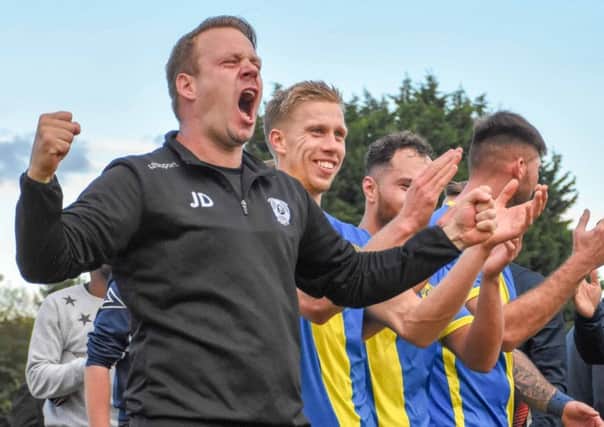 Peterborough Sports manager Jimmy Dean celebrates an FA Cup win over Guiseley. Photo: James Richardson.