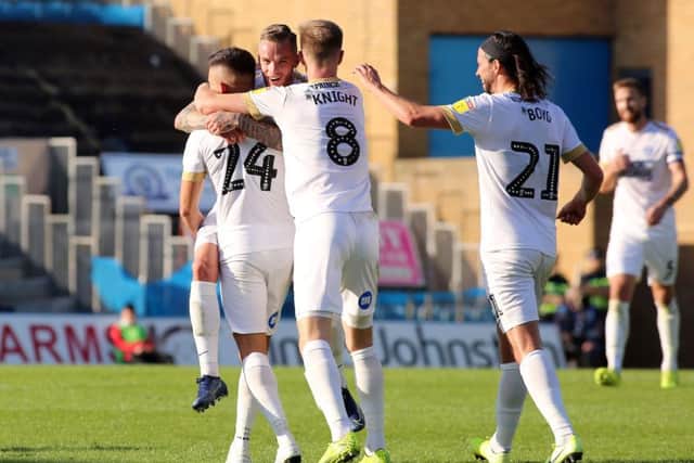Posh players celebrate Joe Ward's goal at Gillingham. Photo: Joe Dent/theposh.com.