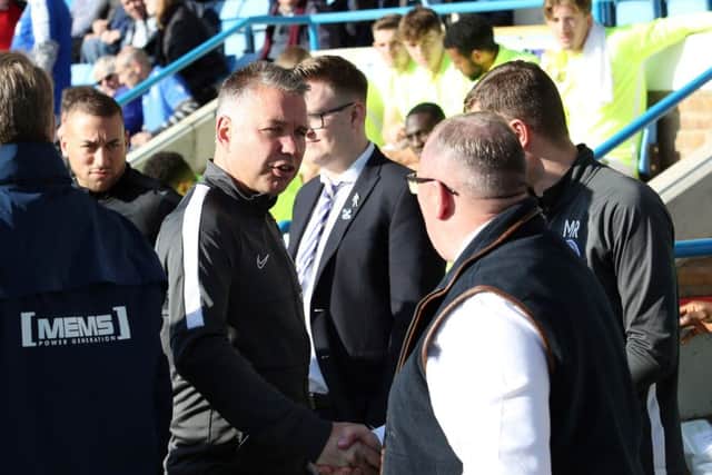 Posh boss Darren Ferguson shakes hands with Gills manager Steve Evans before the game. Photo: Joe Dent/theposh.com.