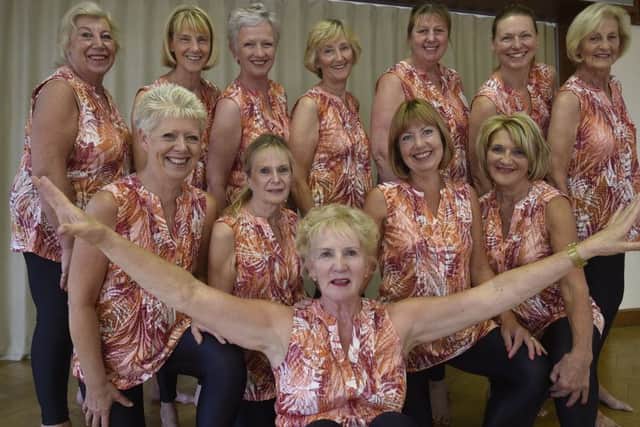Michele Carter, who has been keeping fit for over 50 years, pictured with some of her students.