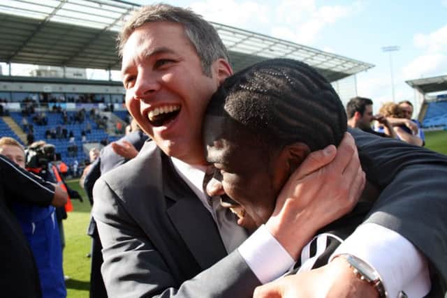 Darren Ferguson celebrates promotion from League One in 2009 with striker Aaron Mclean.