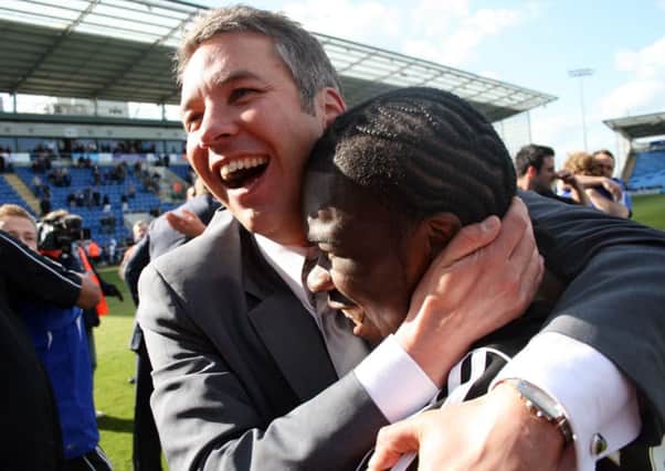 Darren Ferguson celebrates promotion from League One in 2009 with striker Aaron Mclean.