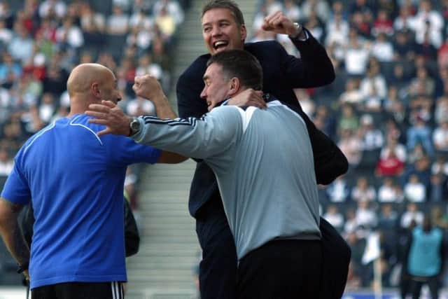 Posh boss Darren Ferguson celebrates Charlie Lee's promotion-winning goal at Colchester.