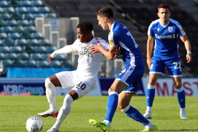 Siriki Dembele (left) in action for Posh at Gillingham. Photo: Joe Dent/theposh.com.