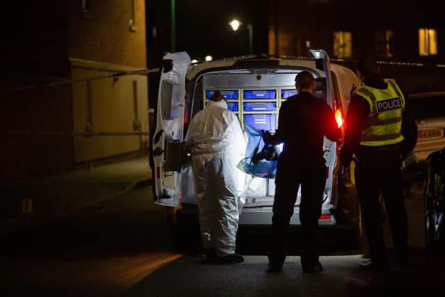 Police at the crime scene: Picture by Terry Harris. THA