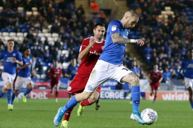 Marcus Maddison of Peterborough United on his way to scoring the opening goal of the game against Accrington Stanley. Photo: Joe Dent/theposh.com.