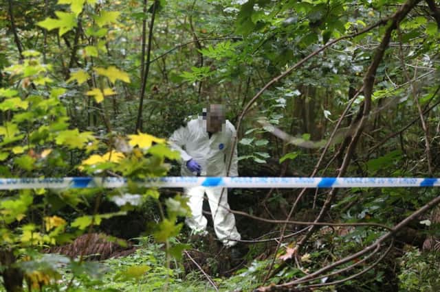 Officers searching the woods near Bringhurst, Orton Goldhay. Photo: Terry Harris