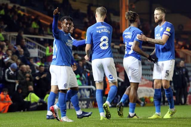 Posh players celebrate a goal against Accrington Stanley. Photo: Joe Dent/theposh.com.