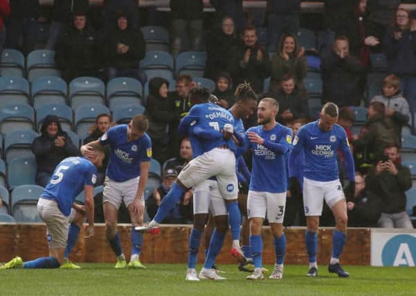Mohamed Eisa of Peterborough United is mobbed by team-mates after scoring a late equalising goal against Coventry. Photo: Joe Dent/theposh.com.