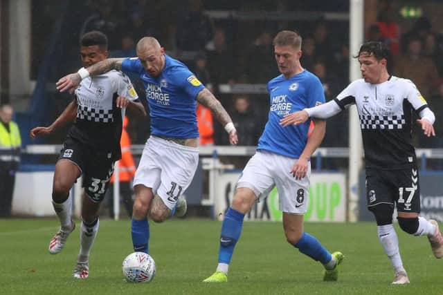 Marcus Maddison on the ball for Posh.