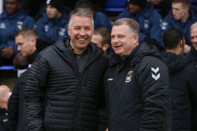 Rival managers Darren Ferguson (left) and Mark Robins before the match. Photo: Joe Dent/theposh.com.