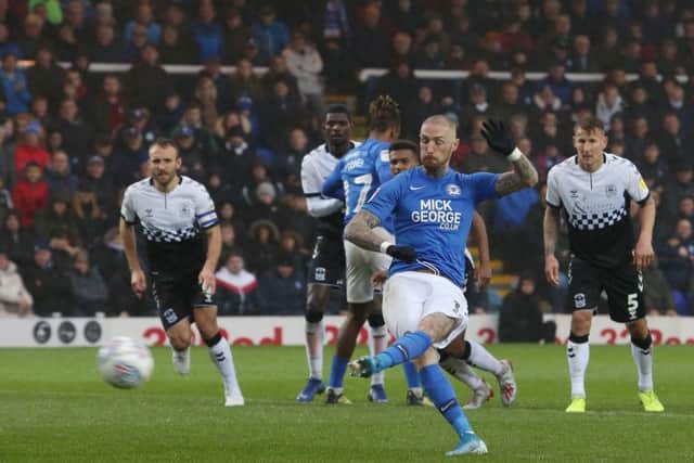 Marcus Maddison of Peterborough United scores from the penalty spot against Coventry. Photo: Joe Dent/theposh.com.