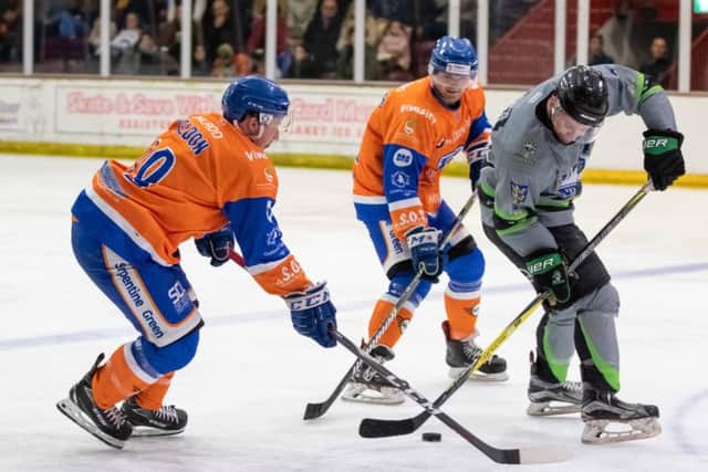 Will Weldon and Conor Pollard battle for puck possession with former Phantom Sam Towner in Saturday's match with Hull. Photo: Tom Scott.