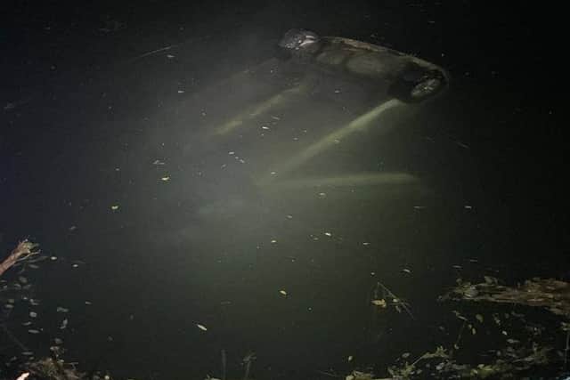 The car submerged in the river