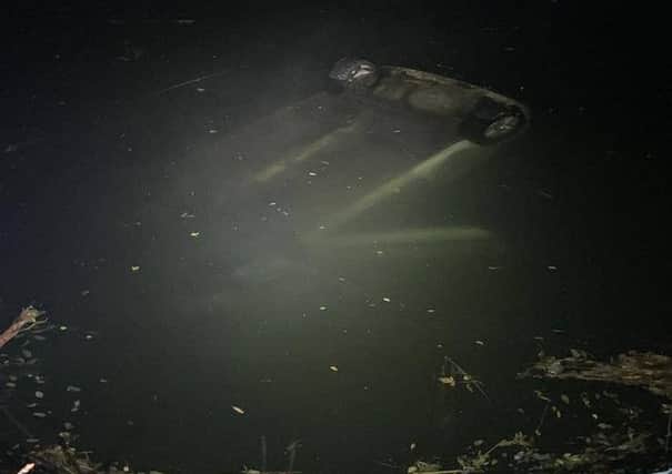 The car submerged in the river
