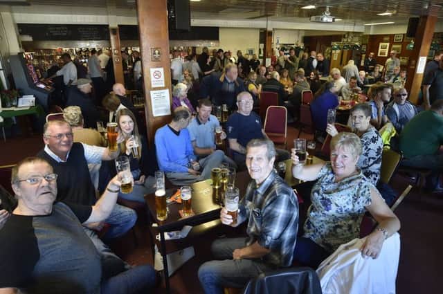 Members of  the Peterborough Sports and Leisure Club toast it goodbye EMN-191027-163851009