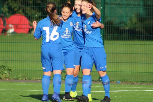 Posh Ladies celebrate the opening goal of the game against New Saints scored by Keir Perkins (yellow boots). Photo: Gary Reed.