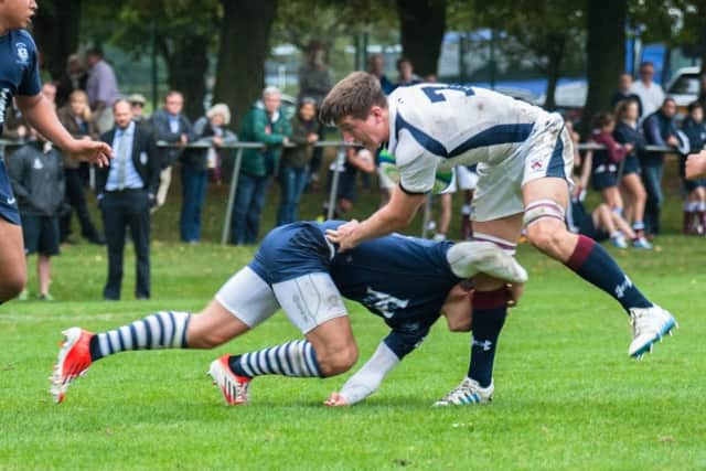 Tom Curry in action for Oundle School
